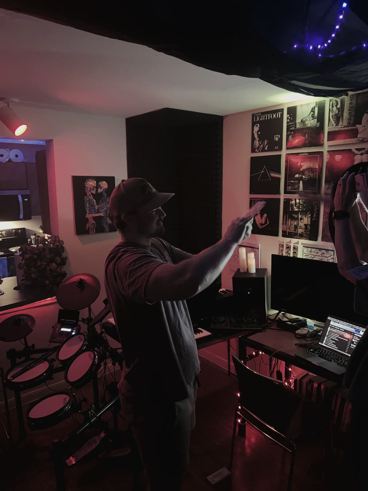 The e-drum kit, desk and record wall
